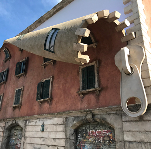Alex Chinneck unzips the fa&ccedil;ade of a building at the Milan Design Week