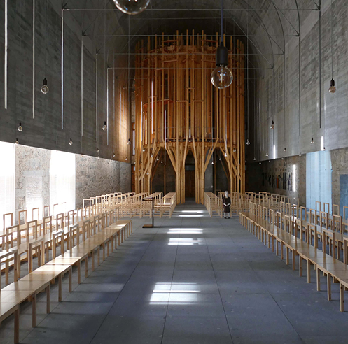 Forest-like wooden structure stands tall inside Imaculada Chapel in Braga
