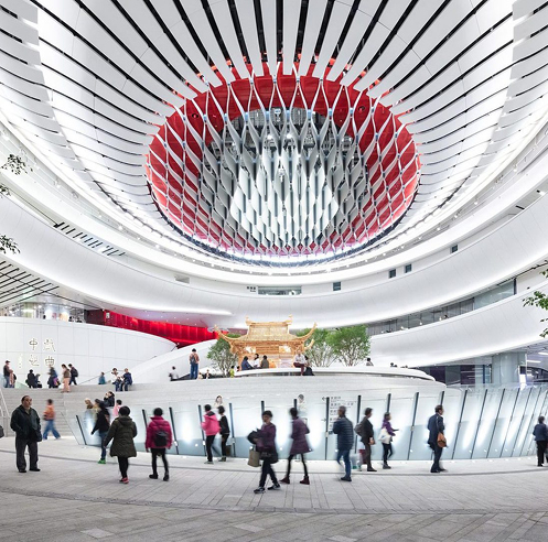 Curved aluminium fins wrap the undulating exterior of Xiqu Centre in Hong Kong