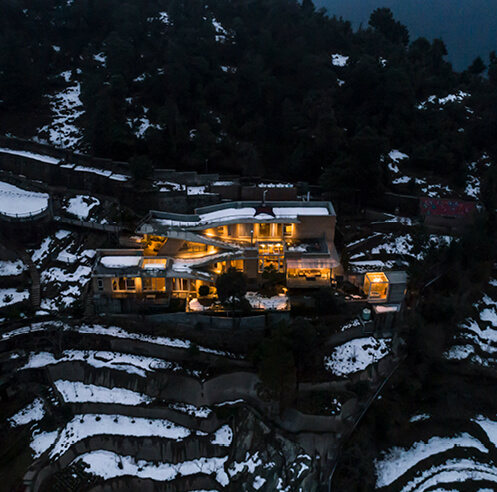 Ant Studio designs a home with sloping roofs and extended terraces in India