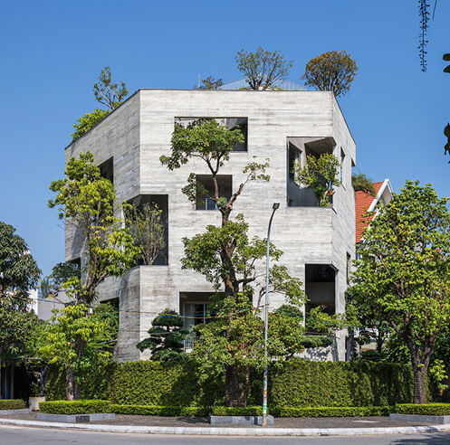 VTN Architects packs a concrete villa with trees on its double skin fa&ccedil;ade in Vietnam
