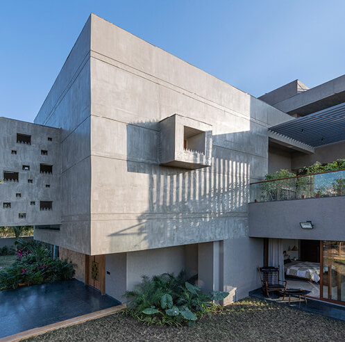 The Grid Architects erect sweeping concrete volumes with Pixel House in India