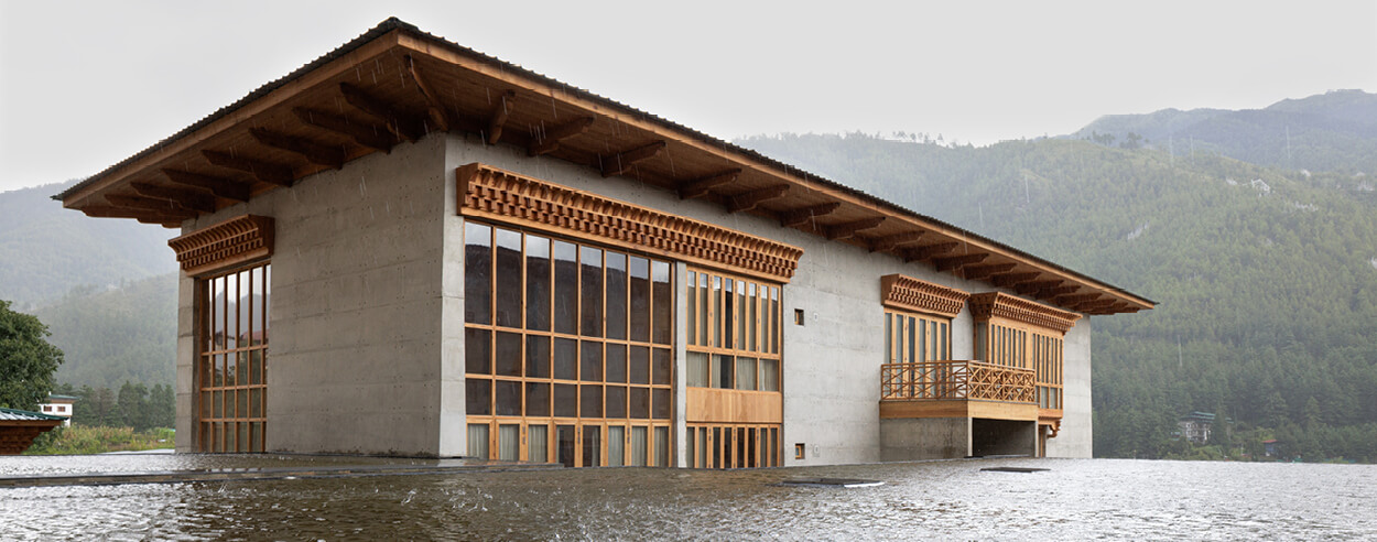 The Bangladesh embassy in Bhutan spans distinct contexts with a central water body The Bangladesh embassy in Bhutan spans distinct contexts with a central water body