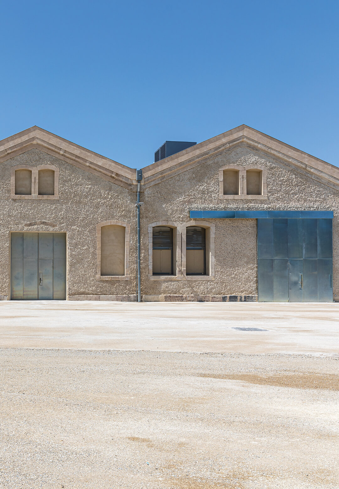 The design for Atelier LUMA’s workspaces in a refurbished railway workshop demonstrate a considered approach to adaptive reuse | La Magasin Électrique | Atelier LUMA + BC architects & studies + Assemb