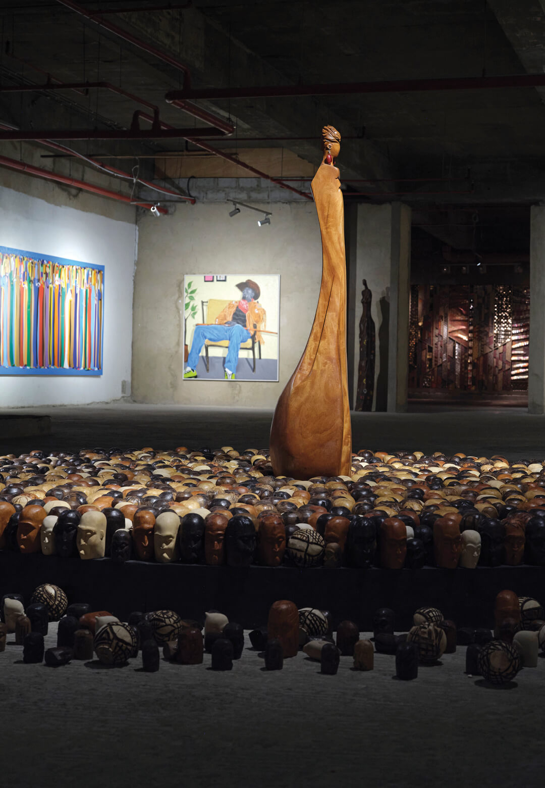 Installation view of Dakriso II -- Beyond Bloodline, African tropical wood, 2011-2024, Kofi Agorsor | Unlimited III: The African Family | Gallery 1957 | STIRworld