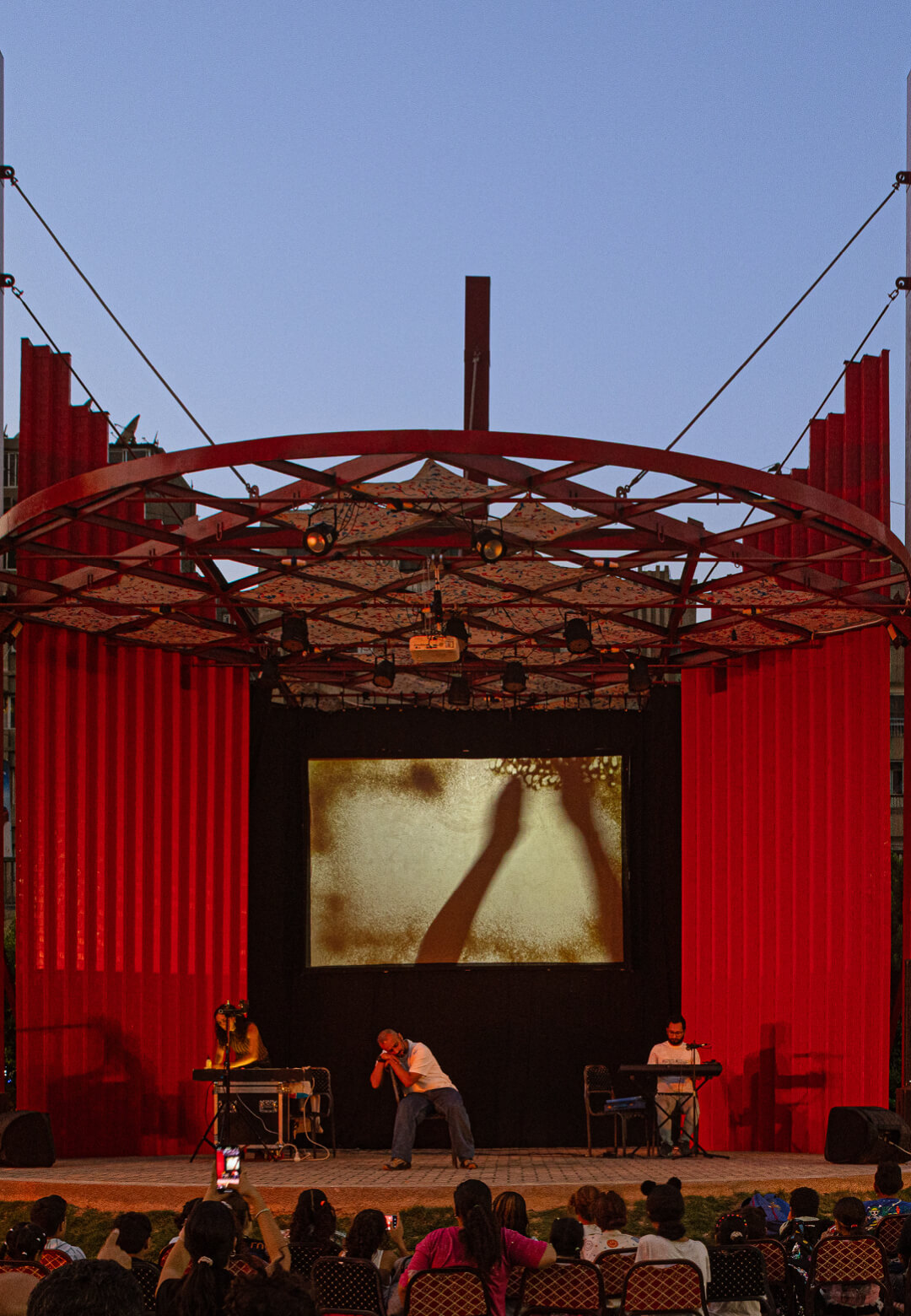 Pergola, a vibrant red structure in the heart of Cairo, reclaims a threatened green space to create a cultural venue for the community | Pergola | THISS Studio | STIRworld