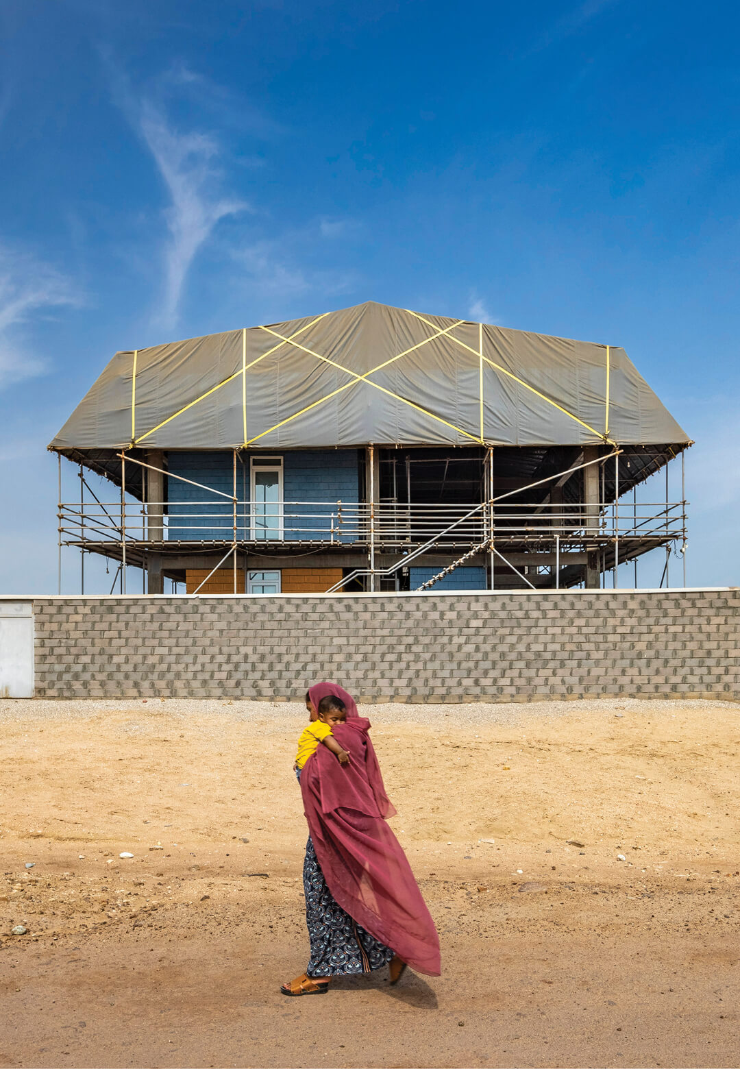 A Hormuzian woman embracing her son, who may once get educated in the Center for Handy Skills by ZAV Architects |Centre for Handy Skills| ZAV Architects | STIRworld