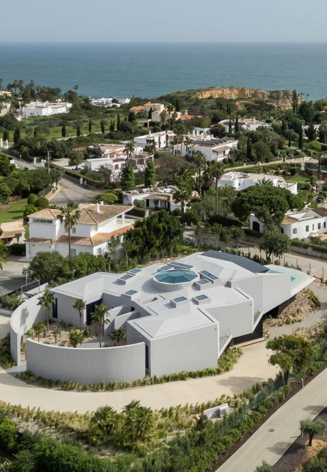 Aerial view of Sky Base One, nestled in the lush landscape of Carvoeiro, Portugal | Sky Base One | Bespoke Architects | STIRworld