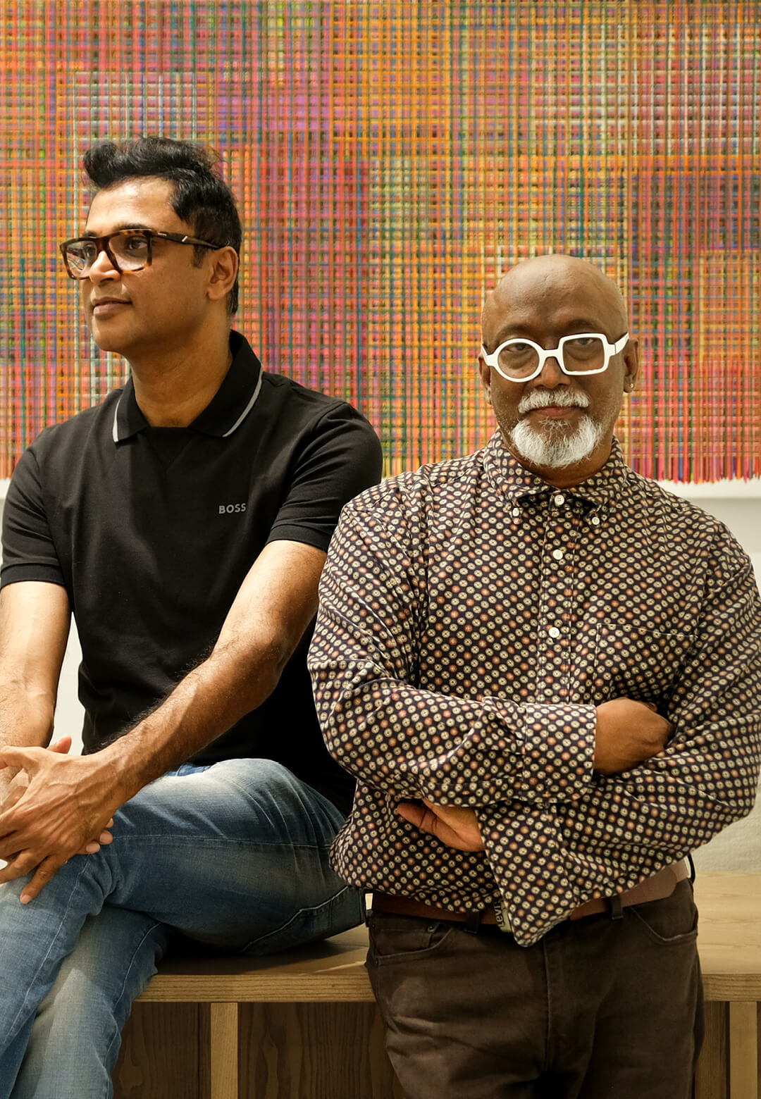 Sreejith Pathangalil and Bose Krishnamachari standing in front of a painting by Harisha Chennangod | DTale Archist | STIRworld