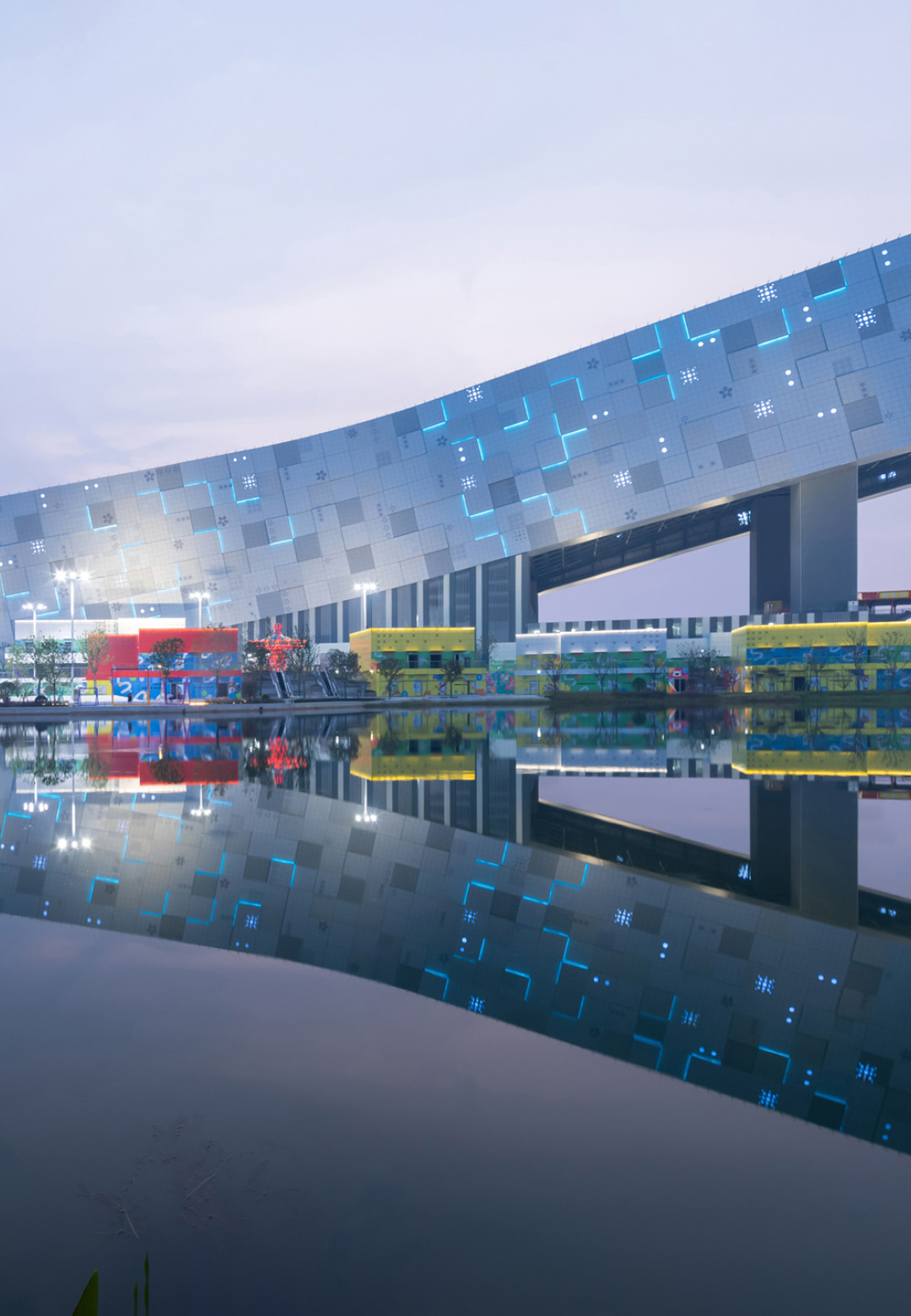 Indoor snow adventures at Wuhan Ski Resort unfold alongside a vibrant outdoor carnival landscape and a mix of indoor and outdoor retail experiences | Wuhan Ski Resort | CLOU Architects | STIRworld