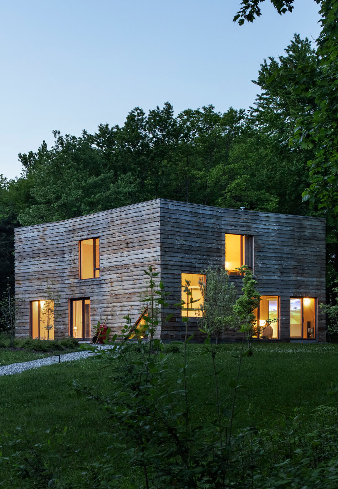 The CLT House by nARCHITECTS blends into its woodland surroundings in Dutchess County, New York| CLT House | nARCHITECTS | STIRworld