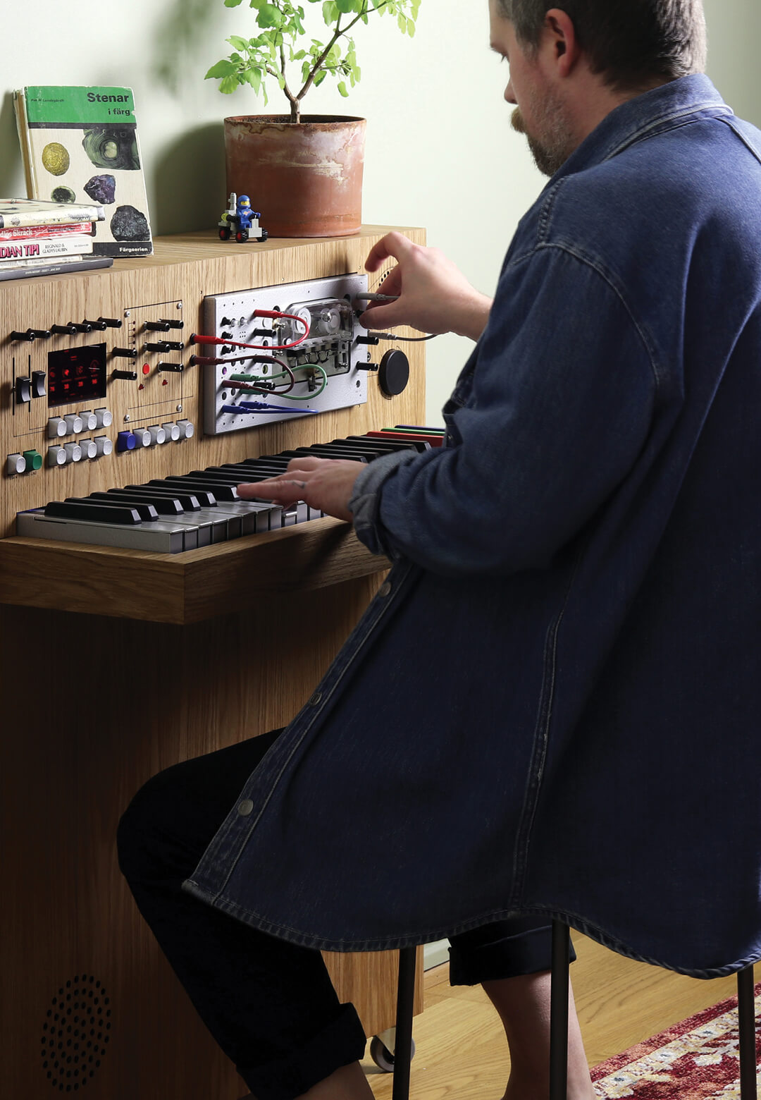 Hultén seated at the redesigned ‘Osmoe’ synthesiser, 2023| Love Hultén | STIRworld