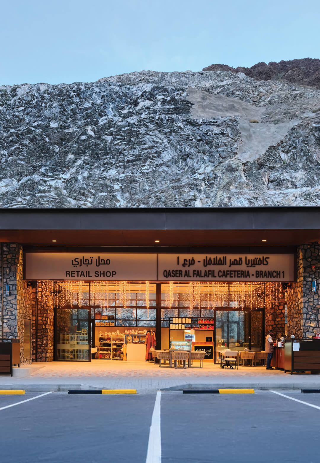 The Shees Market, nestled against the rugged backdrop of mountainous terrain, seamlessly integrates modern architectural design with its natural surroundings | The Shees Friday Market | Shape Architec
