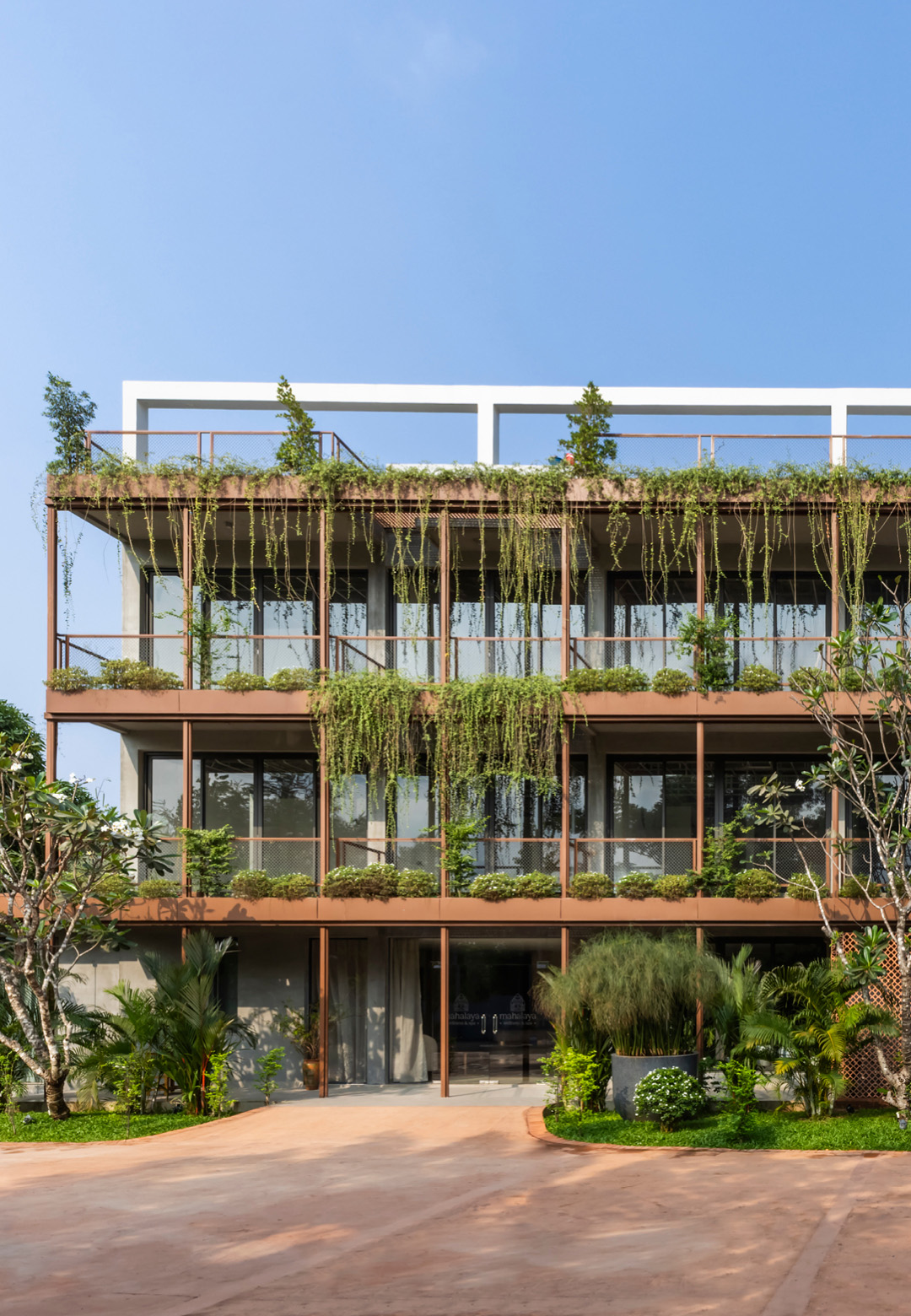 Angkor Grace Residence’s linear façade features cascading greenery, blending architecture with nature and adding depth and texture | Bloom Architecture | STIRworld