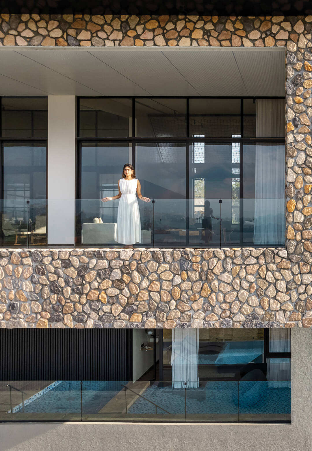 The viewing galleries make for one of the most prominent architectural characteristics of the lakeside villa | House by the Lake | kaviar:collaborative | STIRworld
