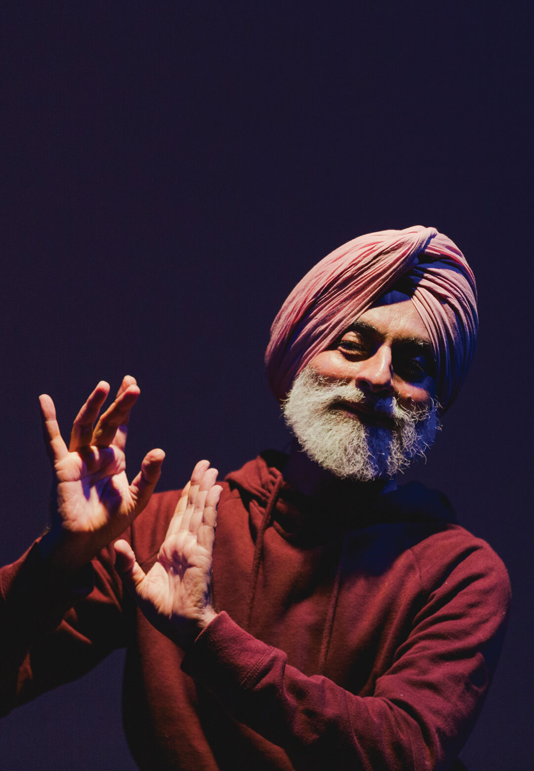 Navtej Johar gazes to one side with his palms turned out at shoulder level in his performance piece Tanashah, 2018, restaged in 2024| Tanashah | STIRworld