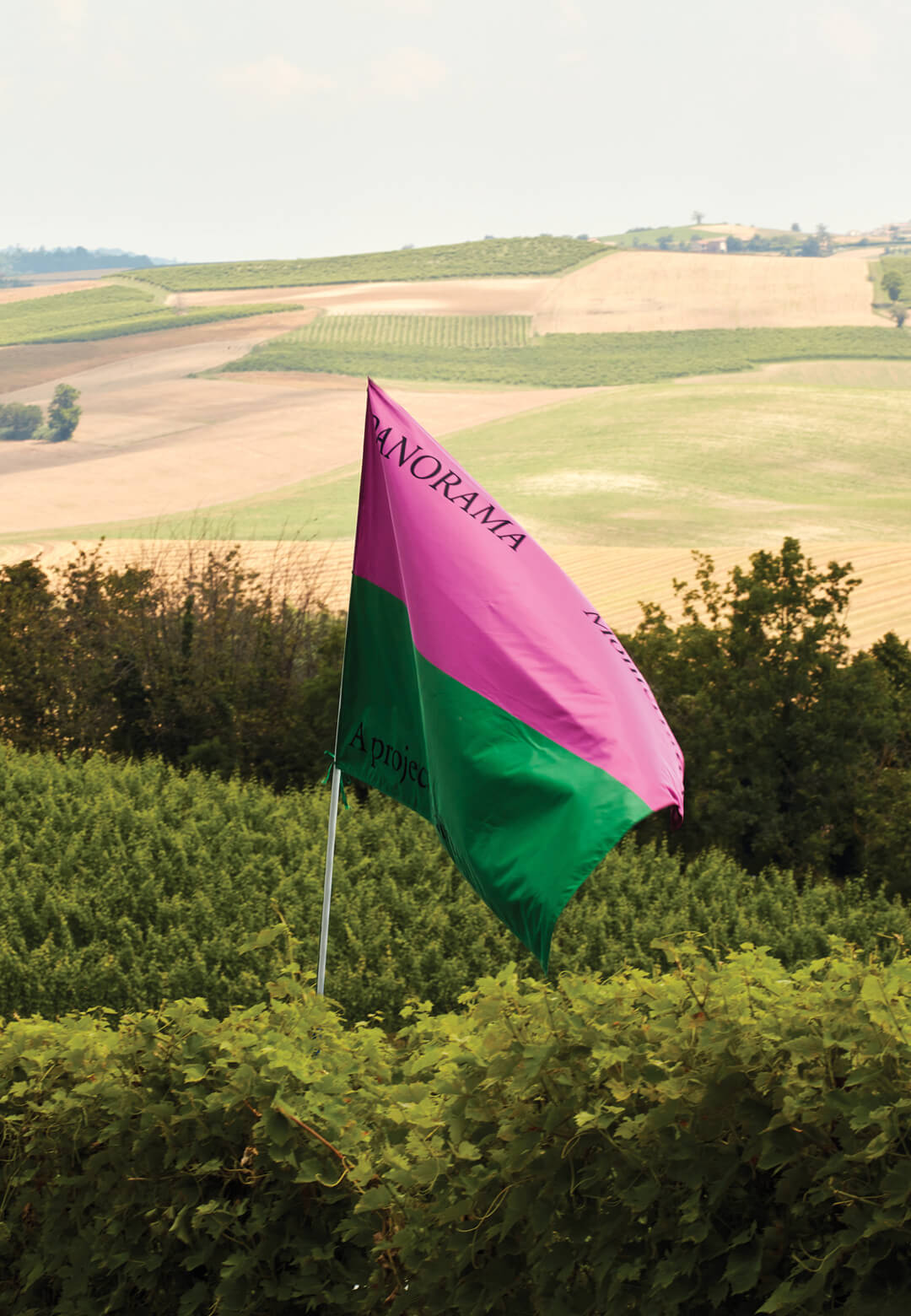 Flag of Panorama Monferrato among the vineyards of Monferrato, a UNESCO heritage site in Piedmont, Italy | Panorama Monferrato | STIRworld
