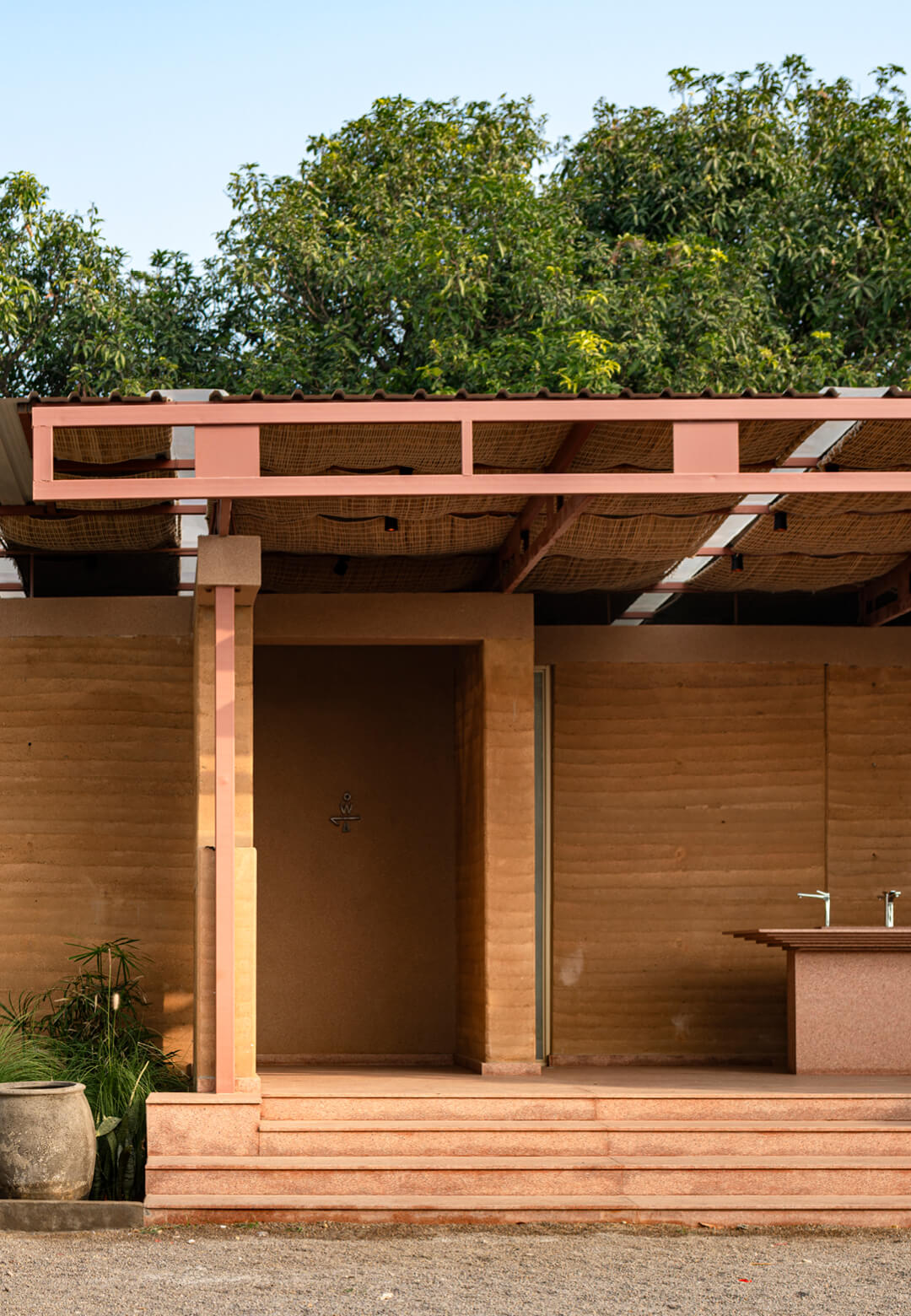 The eco-conscious Aina Retreat community restroom is designed to merge with its natural surroundings in Hyderabad, India | Aina Retreat | NaaV Studio | STIRworld