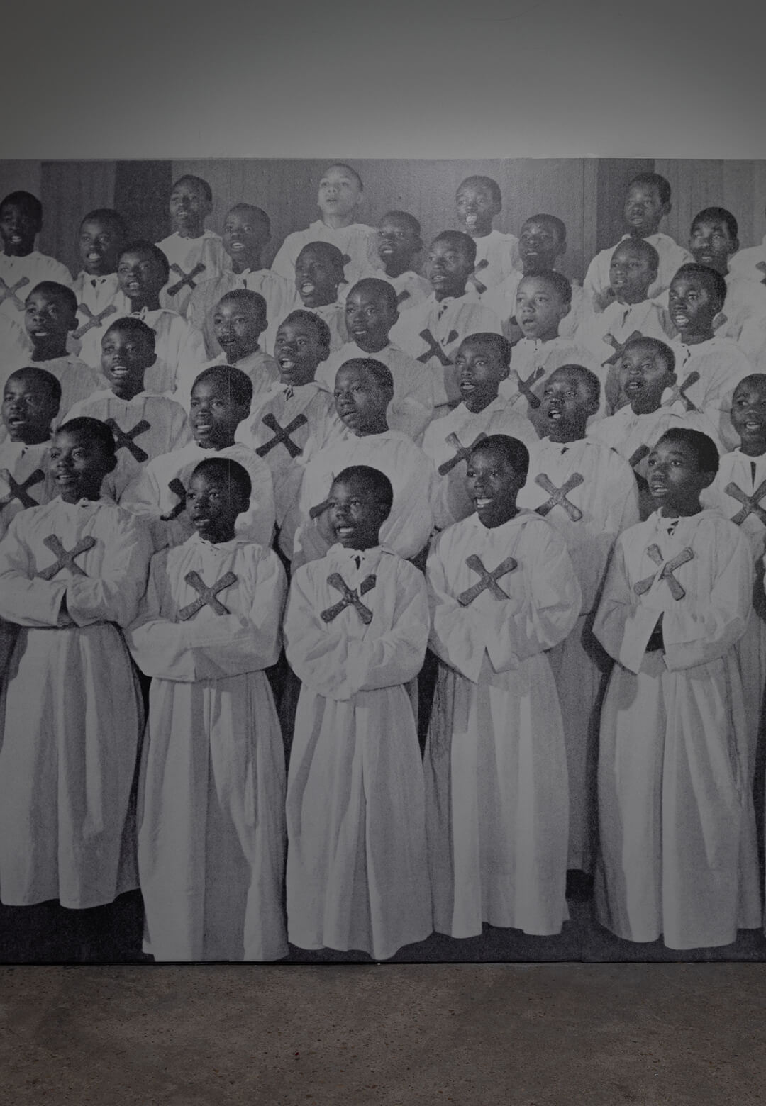 Le petits Chanteurs à la Croix de Cuivre, black-and-white archival photograph as 3 stripes of wallpaper, 1960, Sammy Baloji | Goldsmiths CCA | STIRworld