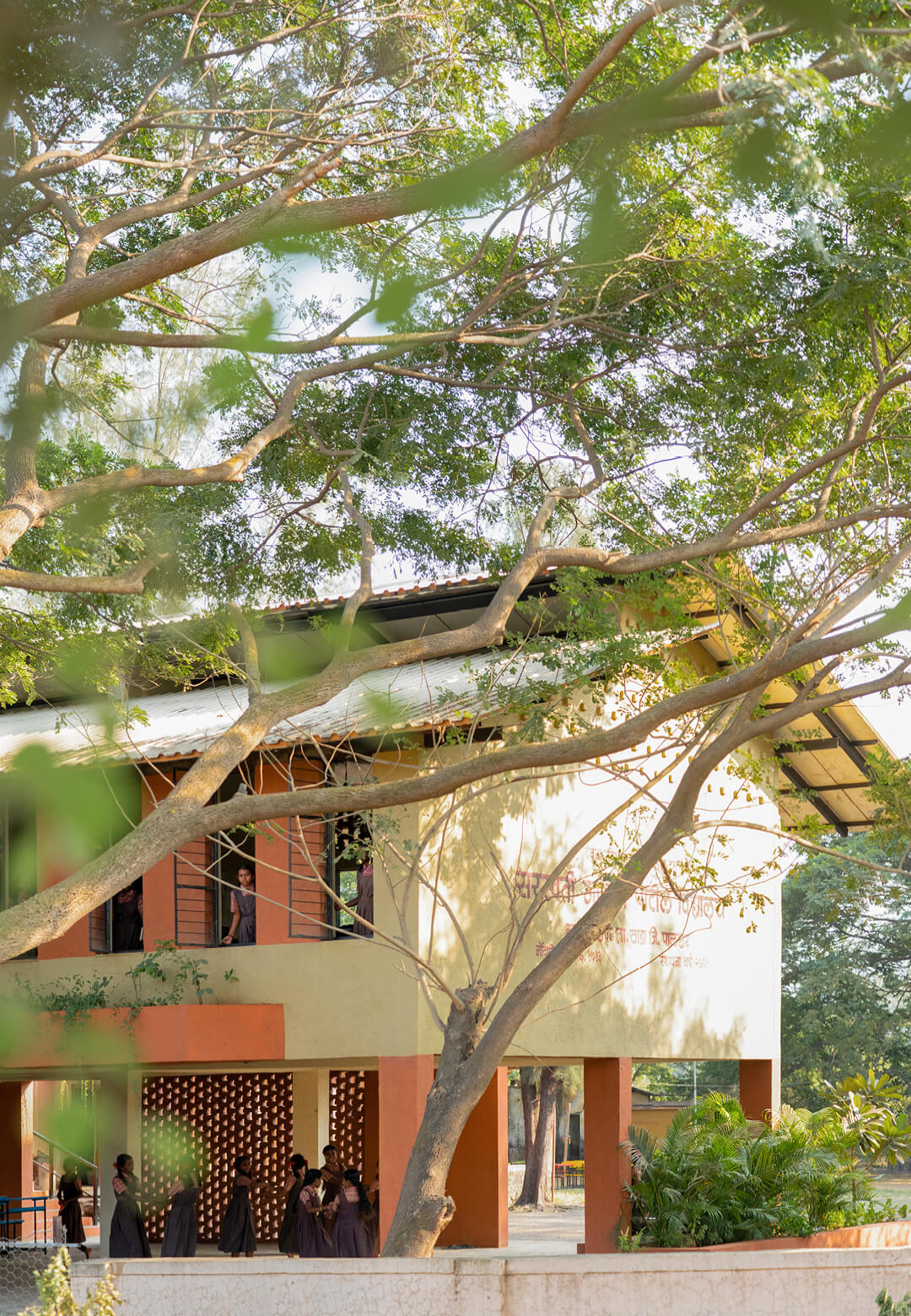 The school building is defined by stilted spaces, jaalis and brick architecture, ensuring floss resilience and optimal indoor temperatures | Rebuilding Flood Resilience: Saraswati Vidyalaya, Kelthan,