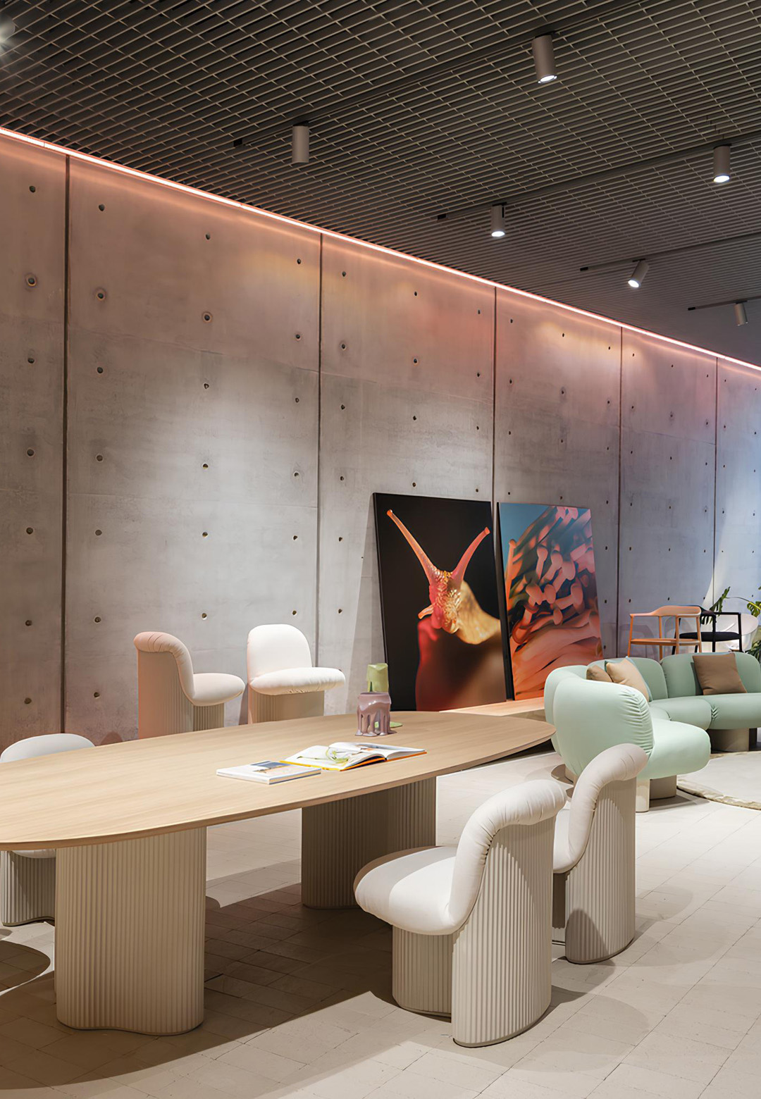 Conference and lounge seating from the &lsquo;Bolete&rsquo; series designed by Patricia Urquiola, including conference table, chairs and sofa, at Andreu World&rsquo;s Milan showroom | Andreu World | STIRworld