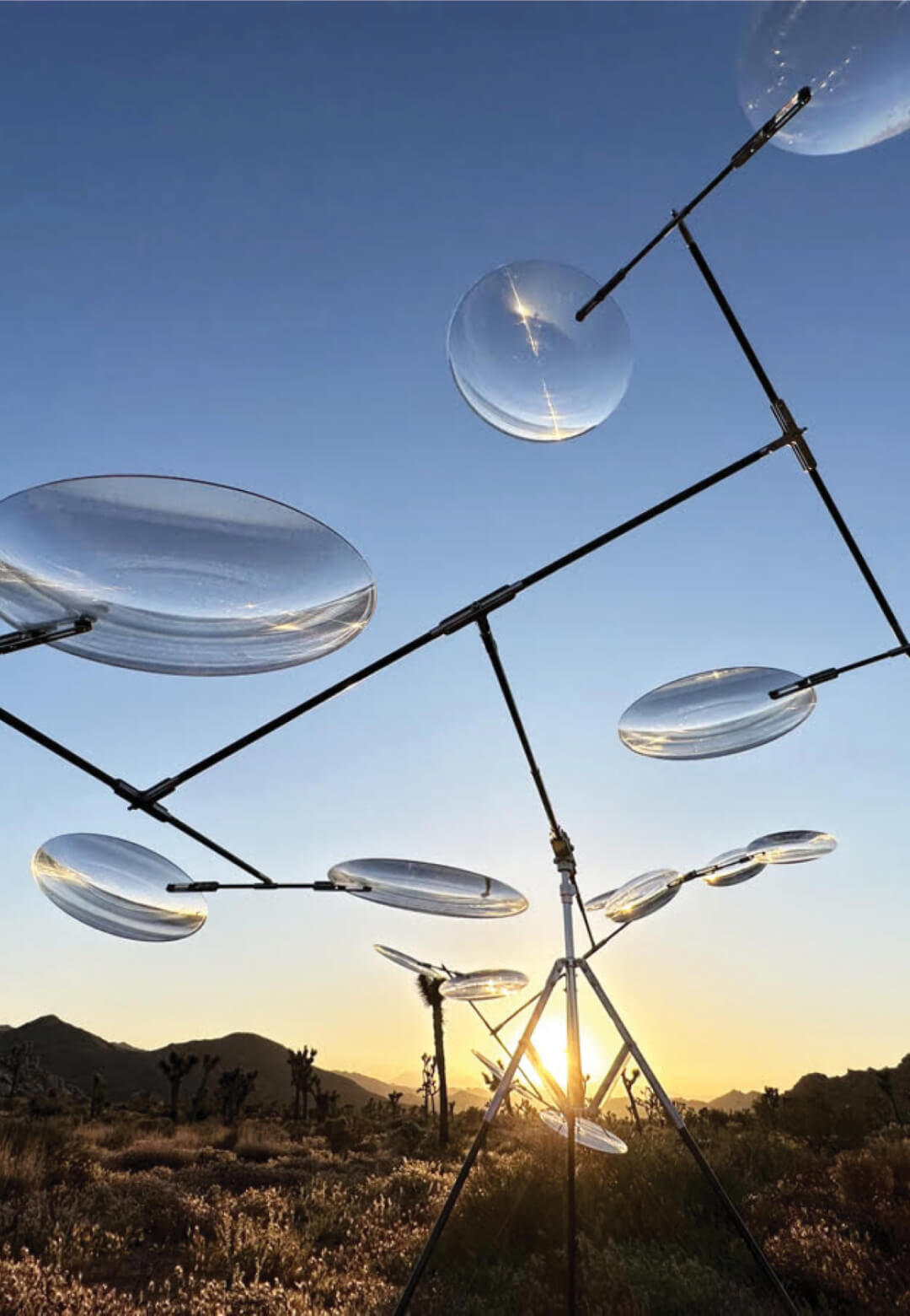 Floating Lenses : Light and airy, the mobile floats above the desert, 2023, Kinetic Sculpture| Floating Lenses | STIRworld