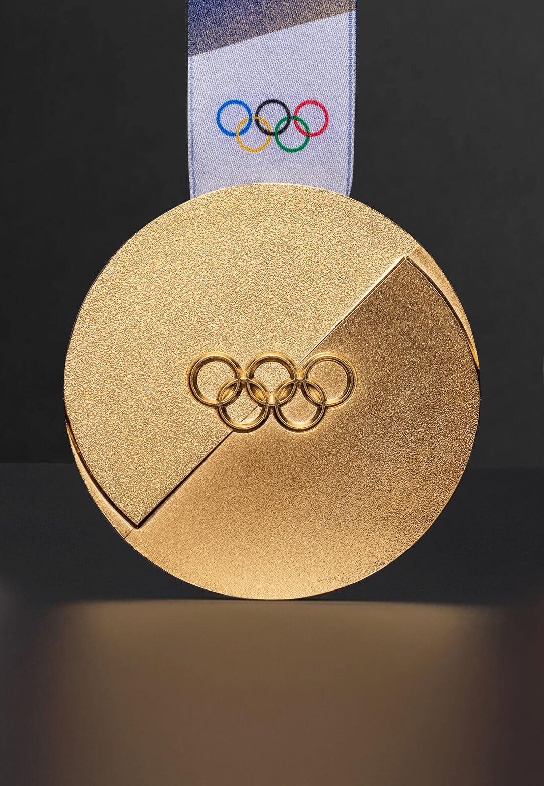 The design evolution of Olympic medals culminates in the Milan&ndash;Cortina 2026 Winter Games medal | Olympic Medal Design | STIRworld