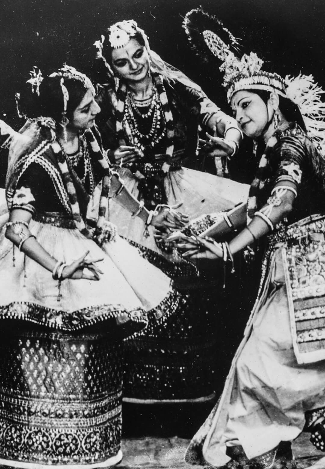 Jhaveri Sisters Dance Company performing the raslila in the traditional costume on stage in the 1970s | Jhaveri Sisters Archive | STIRworld