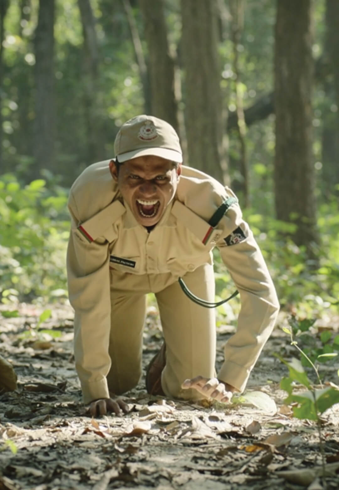 Still from Sherni, Forest guard imitating a tiger for testing the camera trap| Sherni| STIRworld