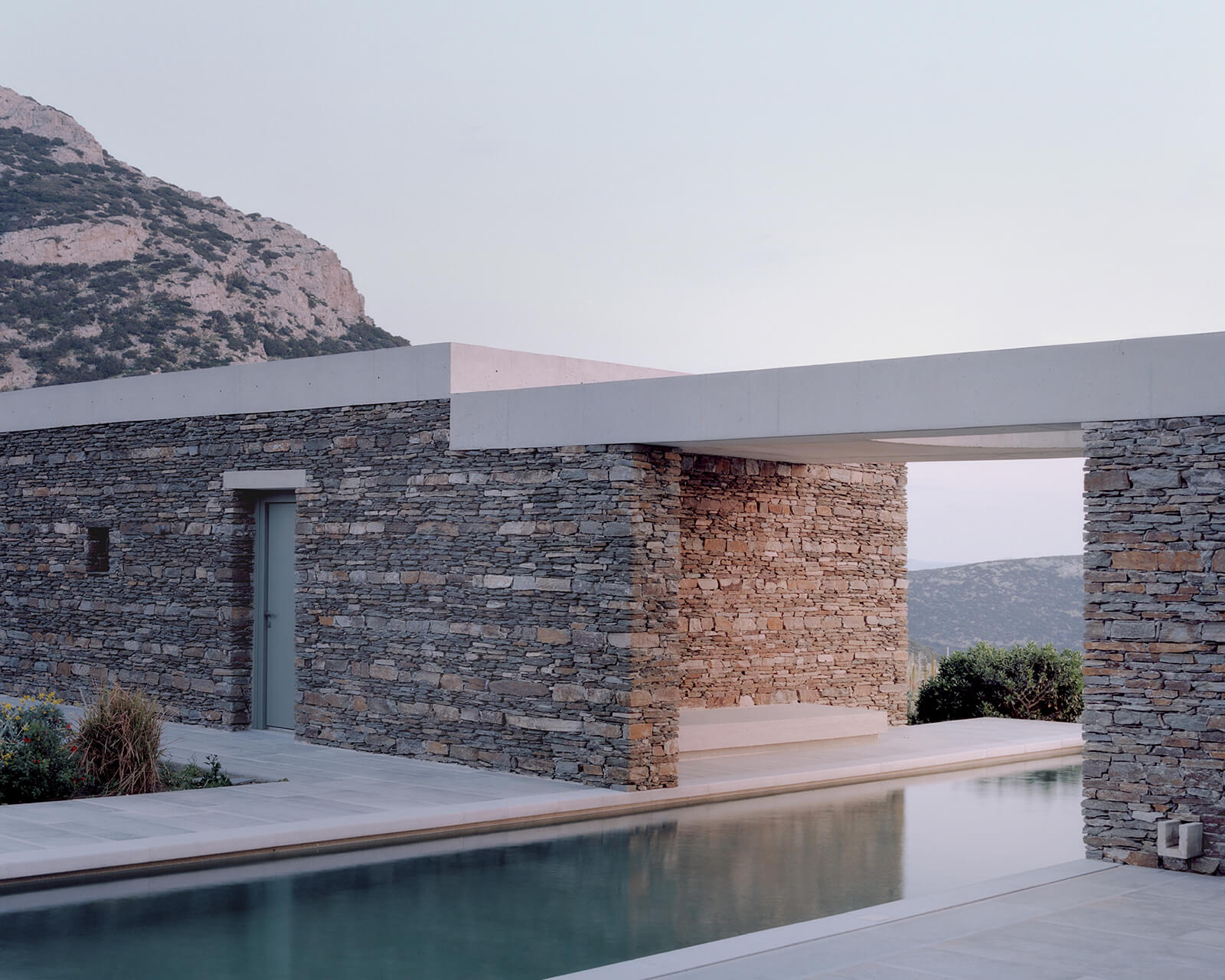 The home’s stone walls frame views of the surrounding context | House with a Garden | OFFICE MUTO | STIRworld