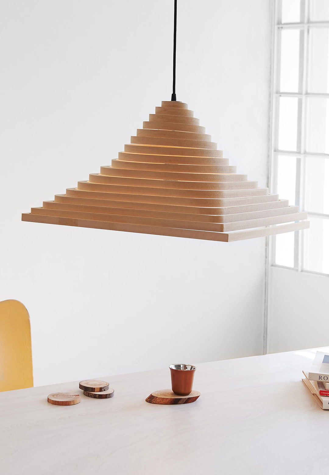 Guillermo Lean&rsquo;s Spinel is a collapsible pendant light made of plywood