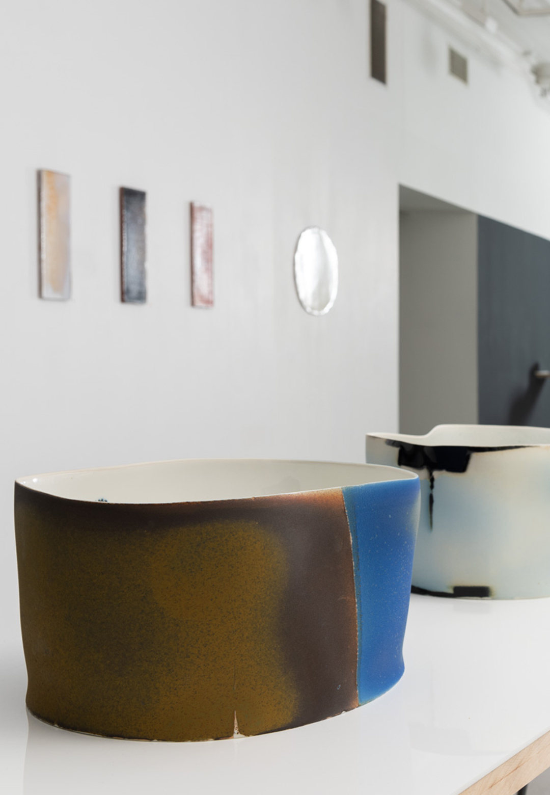 Tray-turned-wall mountings and abstract bowls interact in Format&rsquo;s &lsquo;heuch & malterud&rsquo;